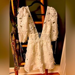 Brand new off the rack. Never worn small white beautiful puffy sleeve dress.